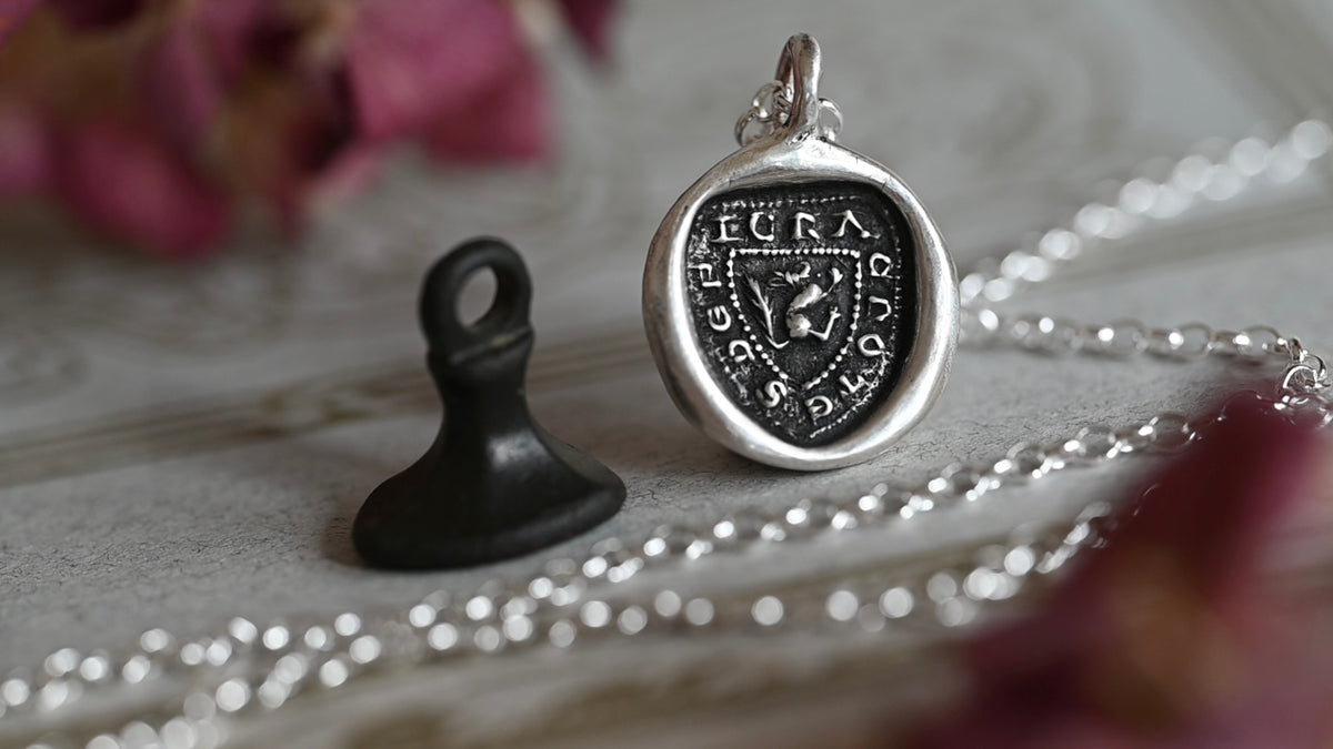"I crack nuts deep" medieval seal necklace
