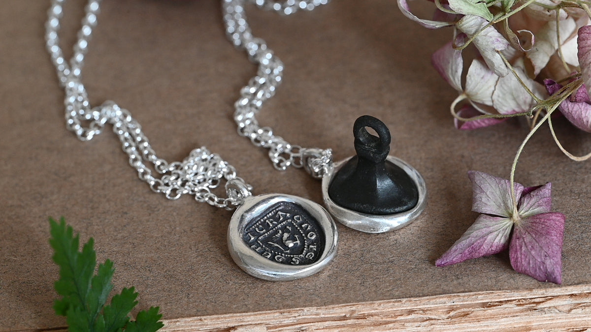 "I crack nuts deep" medieval seal necklace