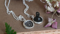 "I crack nuts deep" medieval seal necklace