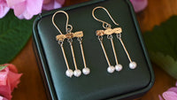 Gold crotalia earrings